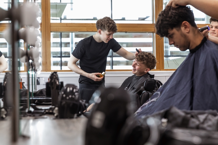 Student working on a barbering project