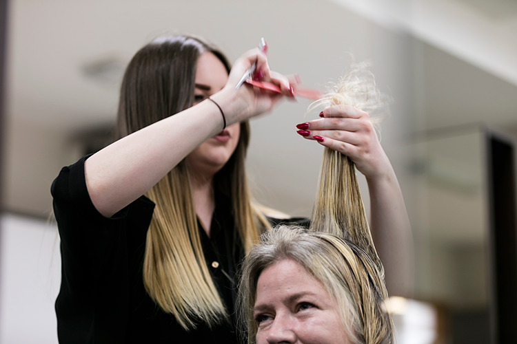 Student cutting hair