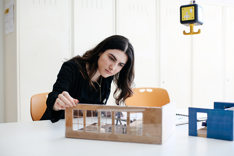 Student looking at a building model