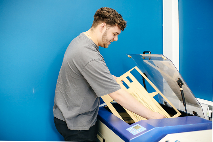 Student creating a building model