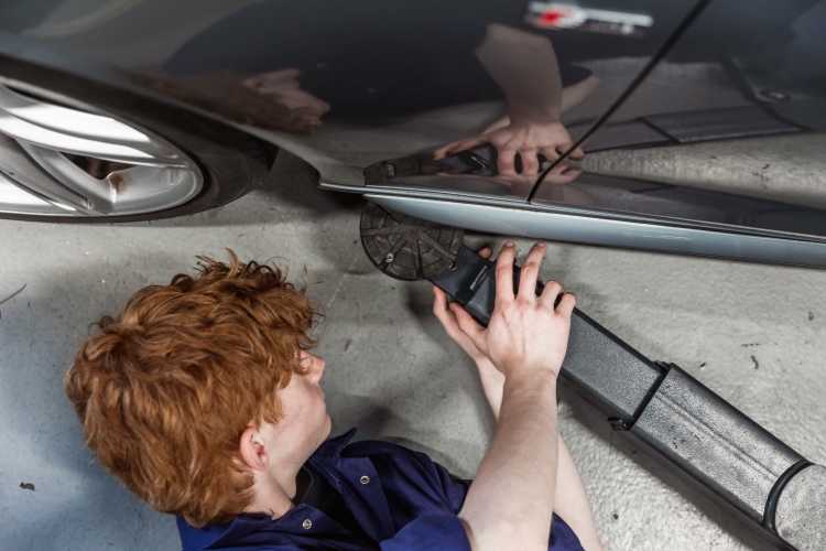Student working on a car