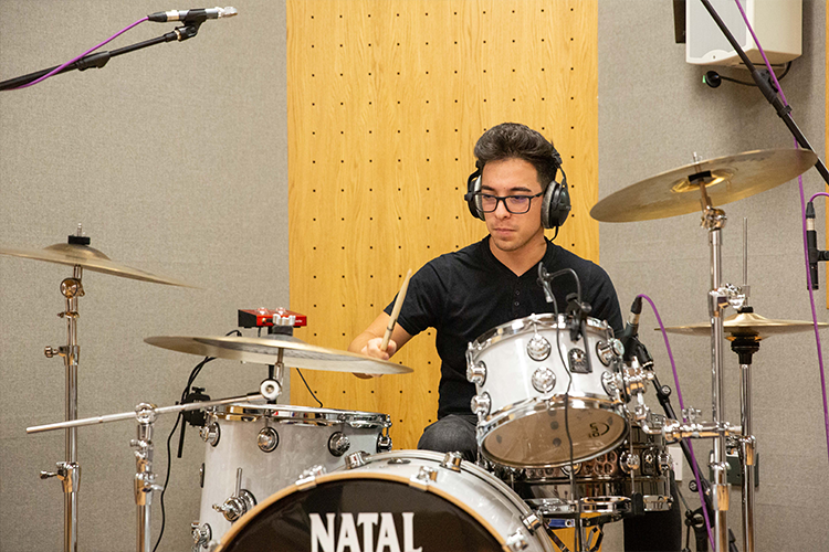 Student playing the drums