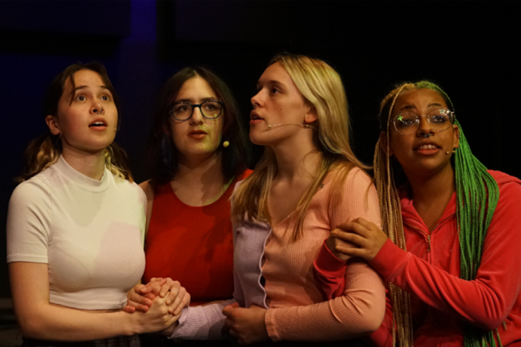 Students singing on stage