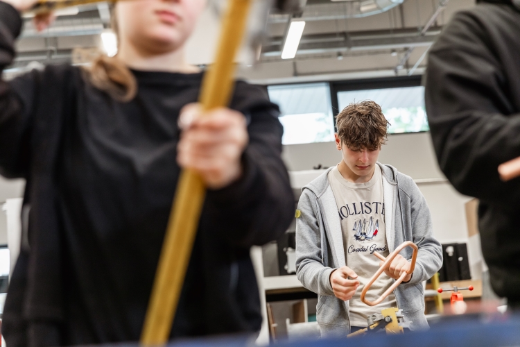 Student working on a plumbing project