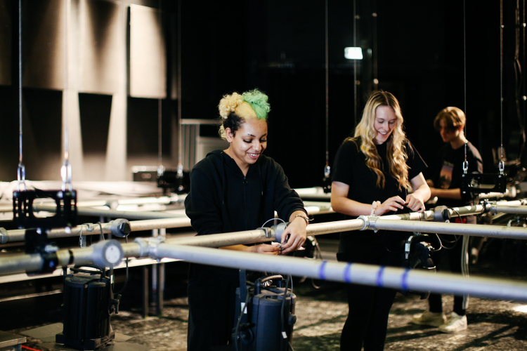 Students setting up lighting