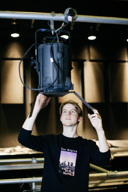 Students setting up lighting