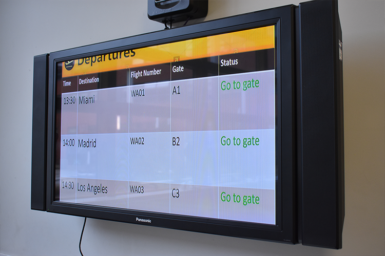 A board with flight numbers, times and gates