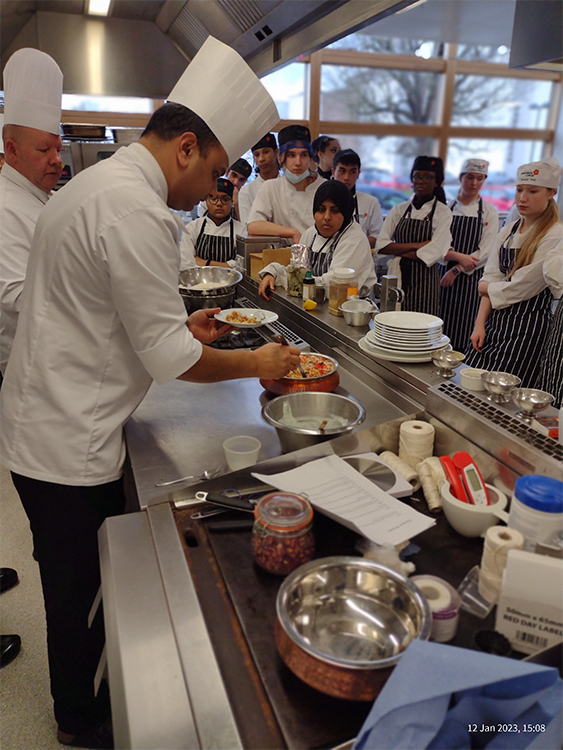 Wembley chef demonstrating cooking biryani