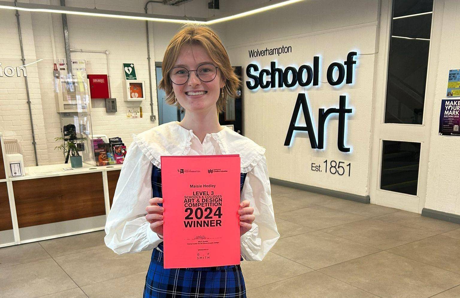 Maisie with her certificate