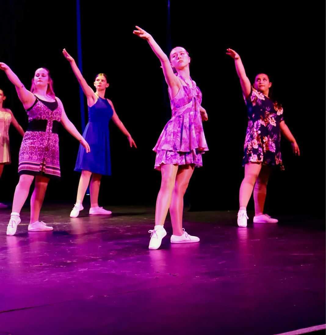 Students performing dance move