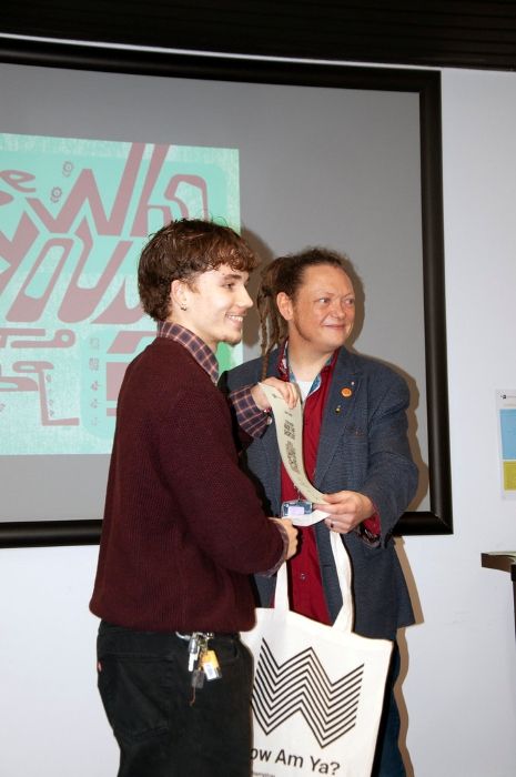 Issac accepting award