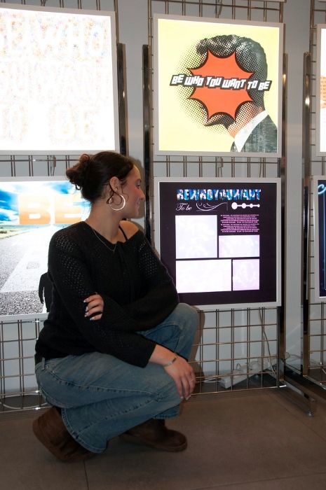 Lily infront of her work