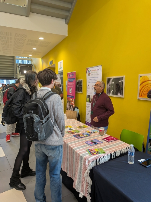Students talking to exhibitor