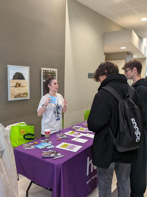Students talking to an exhibitor