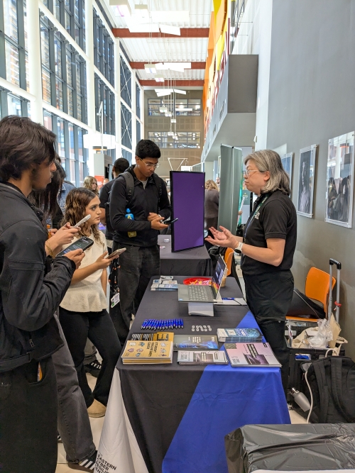 Students talking to an exhibitor