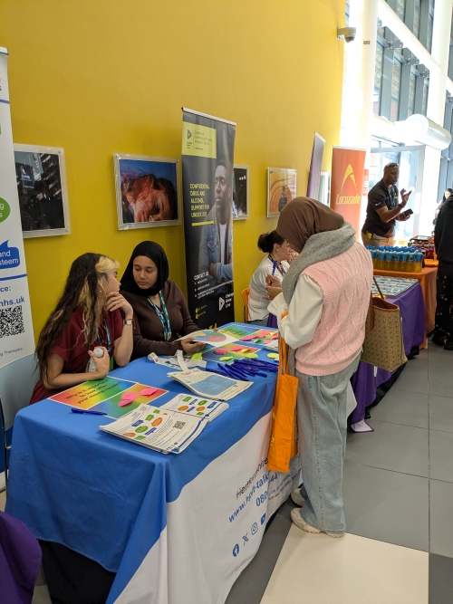 Students talking to an exhibitor