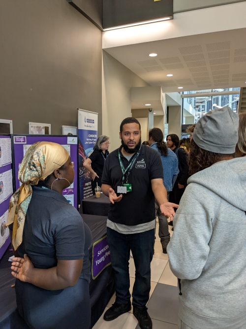 Exhibitor talking to students