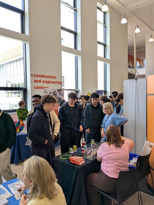 Students talking to an exhibitor